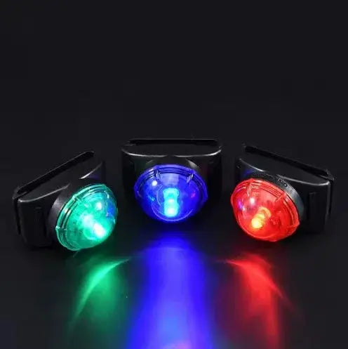 Three LED lights in green, blue, and red on a black background
