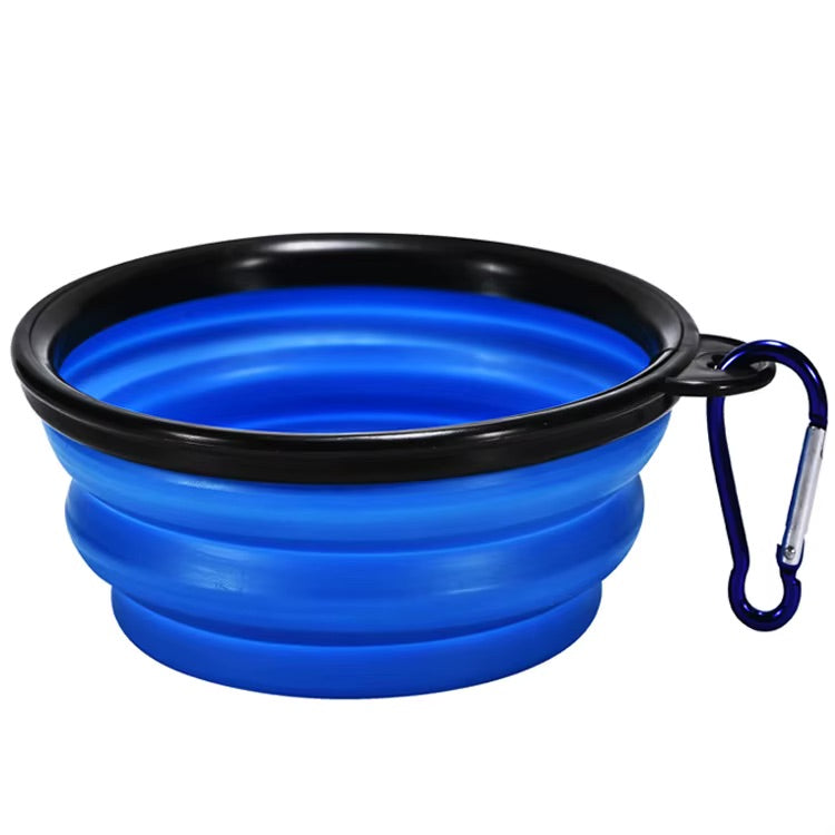 Blue collapsible dog bowl with black rim and carabiner on a white background