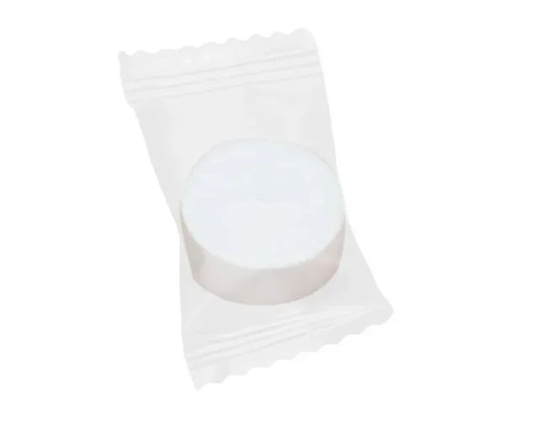 Close up of compressed dry towelettes , showcasing the product on a white background.