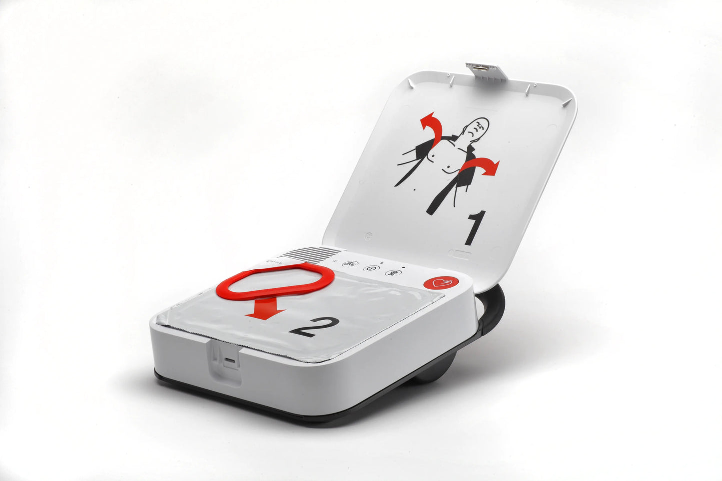 LIFEPAK CR2 defibrillator open with electrode pad package and illustrated pad placement instructions.