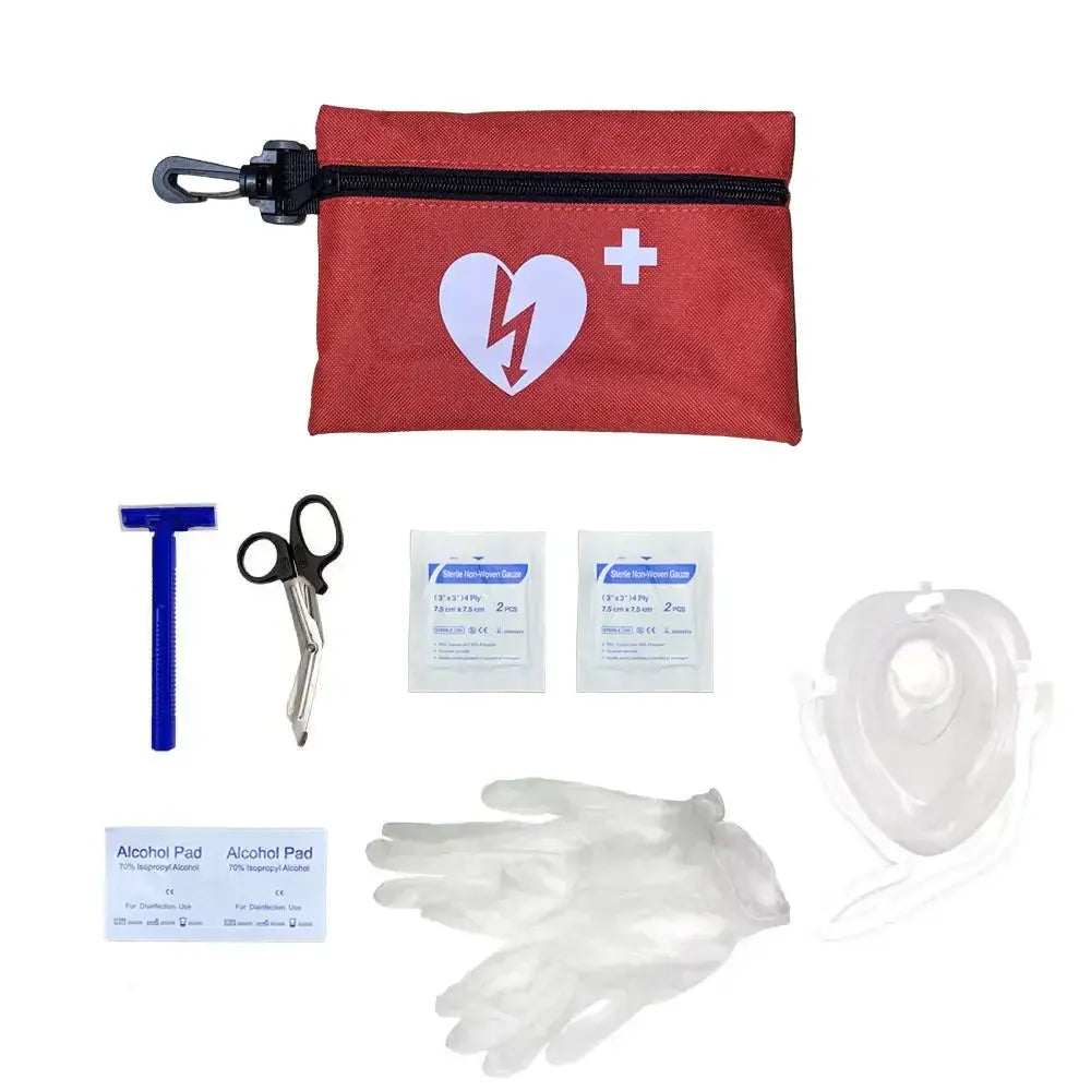 AED Prep Kit with red pouch, scissors, gloves, alcohol pads, razor and a CPR mask on a white background.