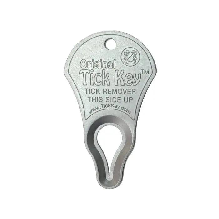 Silver tick key for easy tick removal, featuring a clear "Tick Key" label on a white backdrop.