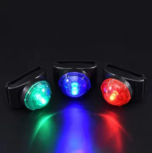 Three LED lights in green, blue, and red on a black background