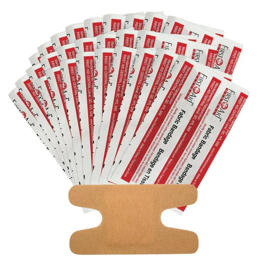 Multiple packages of First Aid Only brand bandages on a white background