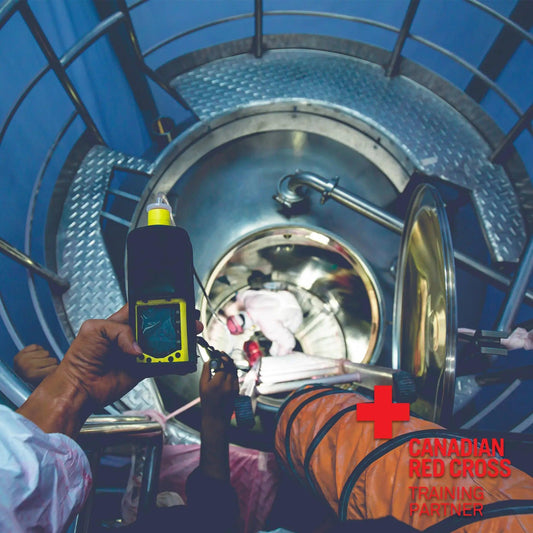 A person holding a device for H2S detection.
