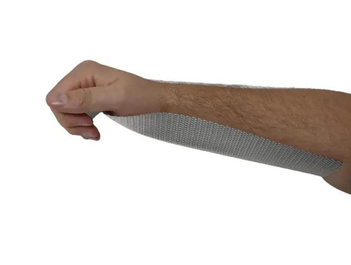 A person holding a bandage on their arm with a Mesh Wire Aluminum Splint.